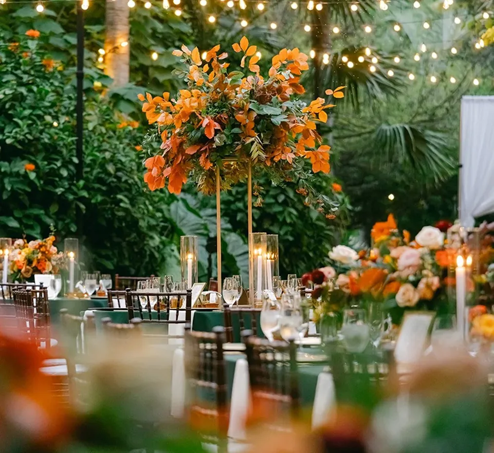 Exterior view of Miami Beach Botanical Garden with palm trees, a golf course, and a clubhouse