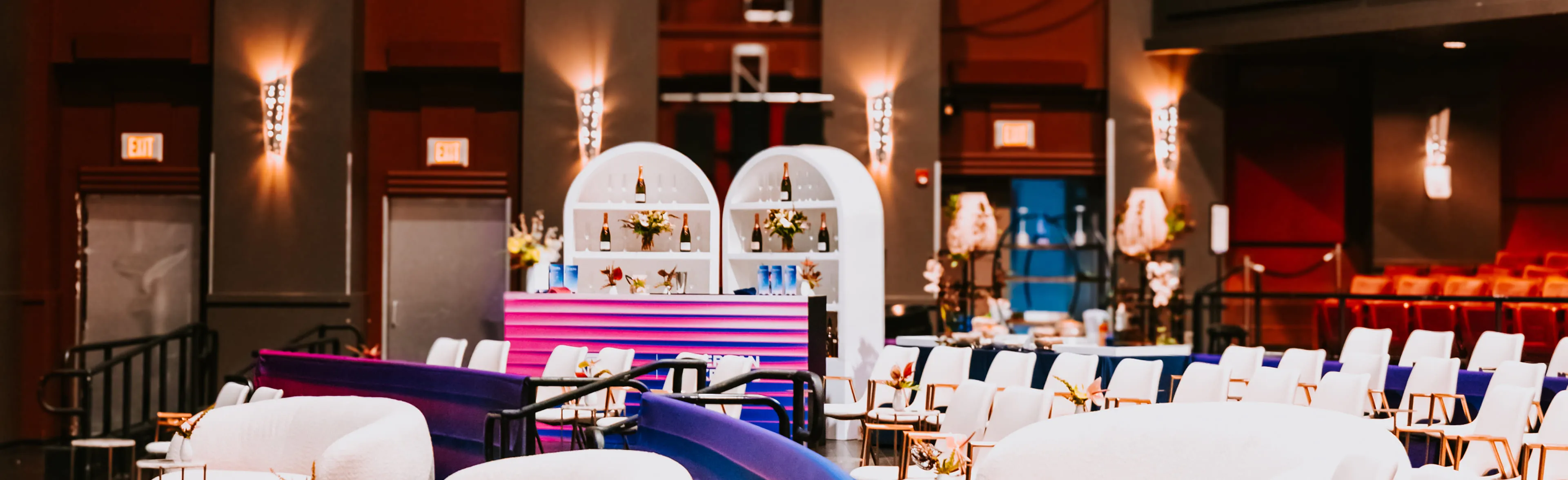 Wedding ceremony at Nova 535 with the couple exchanging vows surrounded by bridesmaids, groomsmen, and lush tropical greenery