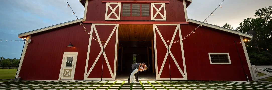 Wedding ceremony at Tringali Barn at Heritage Farms with the couple exchanging vows surrounded by rustic barn charm and natural beauty