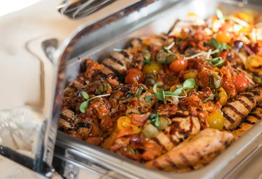 Elegant catering table with assorted appetizers and finger foods arranged for a wedding reception