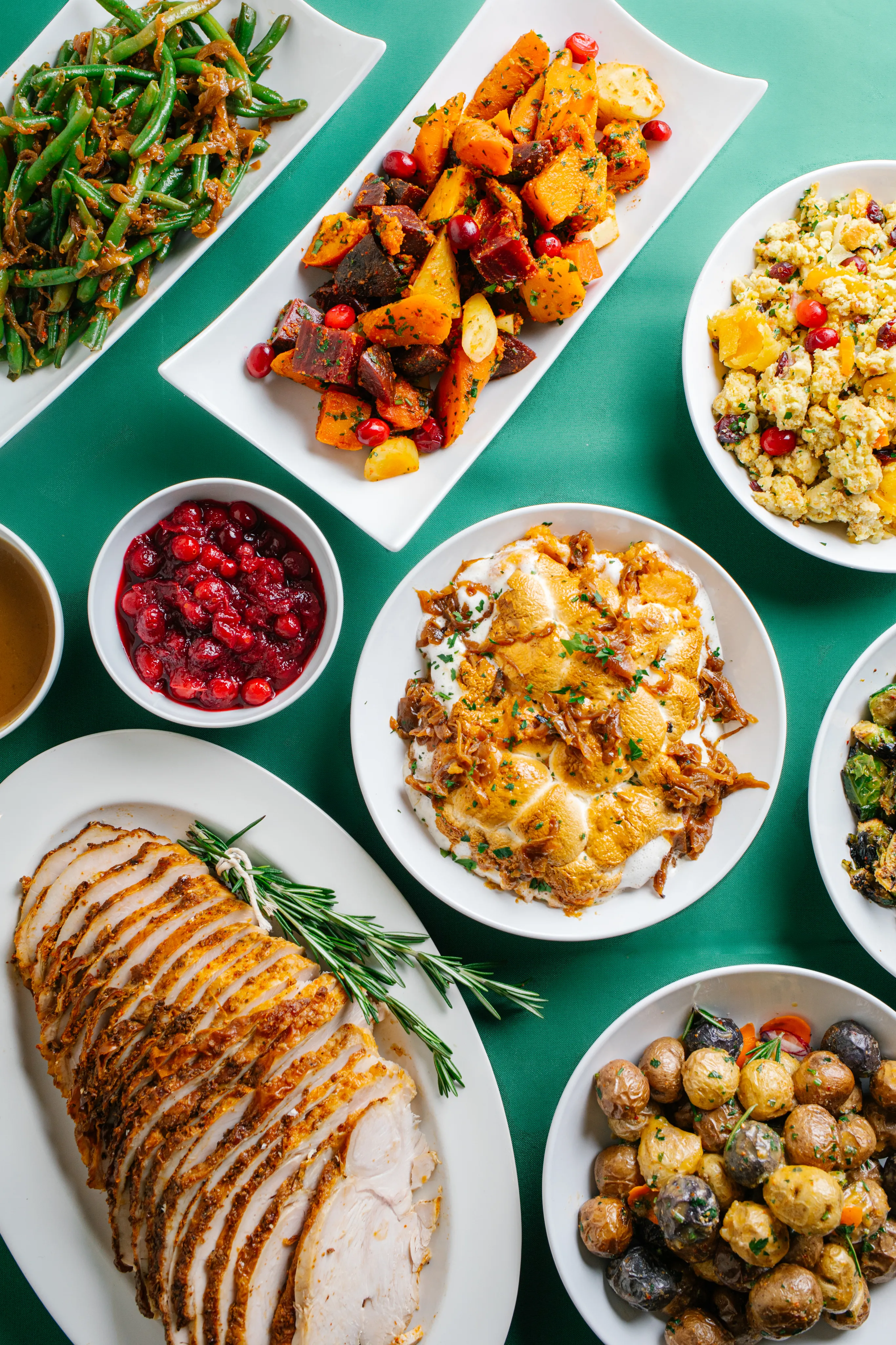 Cranberry sauce and roasted squash served on a green table